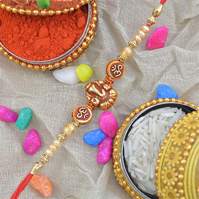 Center Base Lord Ganesha with Om And Pearls Rakhi
