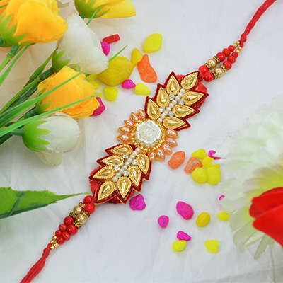 Awesome Golden Flower Zardosi Rakhi with Multicolor Pearls along with Silk Thread