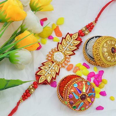 Awesome Golden Flower Zardosi Rakhi with Multicolor Pearls along with Silk Thread