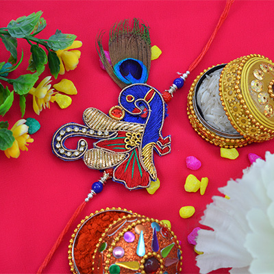 Delectable Peacock Zardosi Rakhi with Attractive Beads 