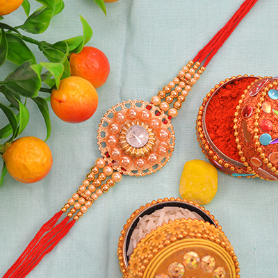 Stunning Graceful Rounded Zardosi Rakhi with Beads