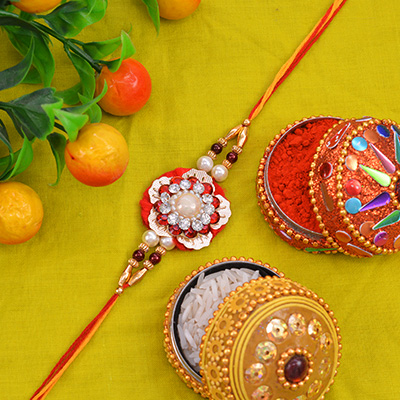 Beautiful Flower Shape Pearl Zardosi Rakhi with Golden Pearl along with Multi-Color Silk Thread